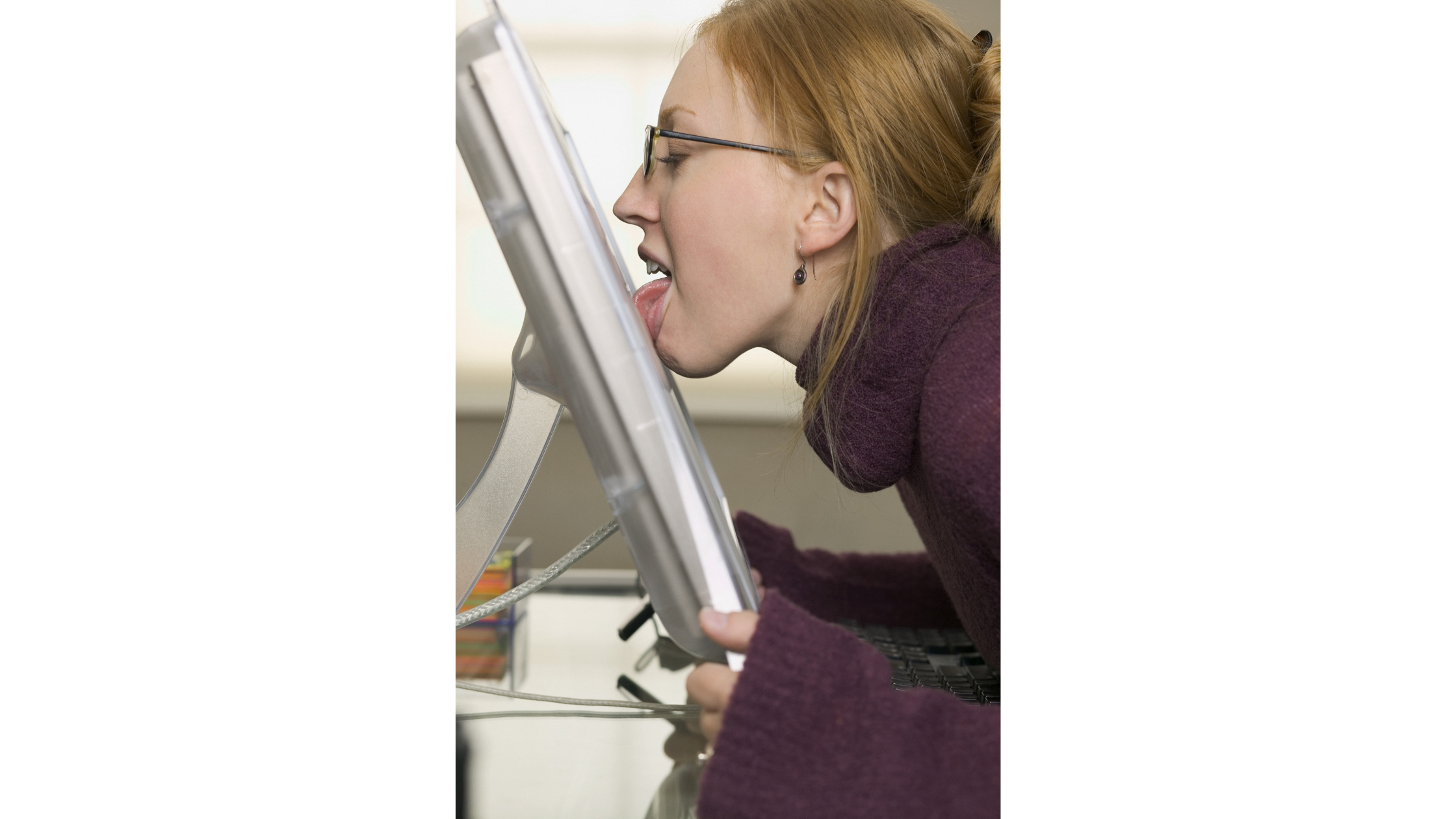 Person licking a computer screen