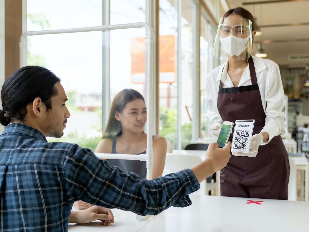 Restaurant guest scanning QR code to place an order